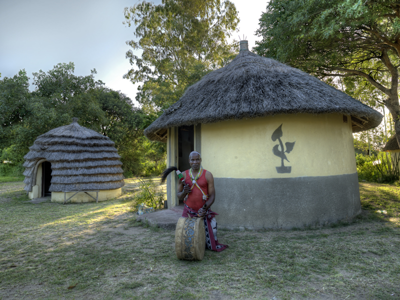 A Sangoma in front of the healer's hut.
