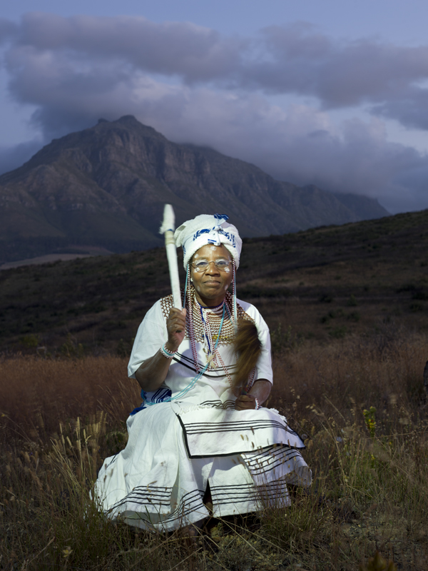 A Sangoma sitting in the field