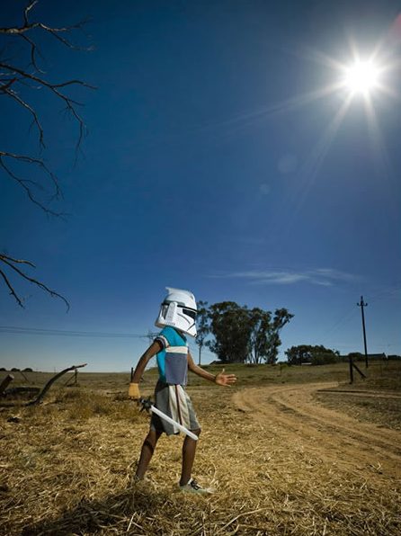 Native Kid in South Africa playing Stormtrooper in rural area.