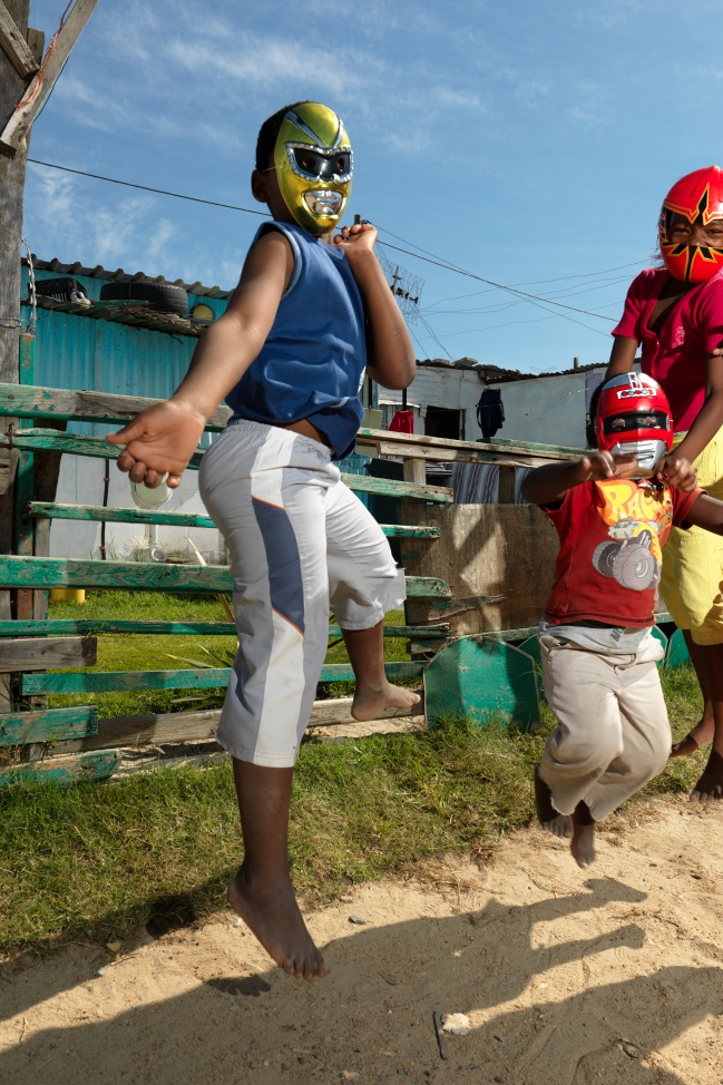 Four Little Superheroes wearing masks and jumping in South Africa